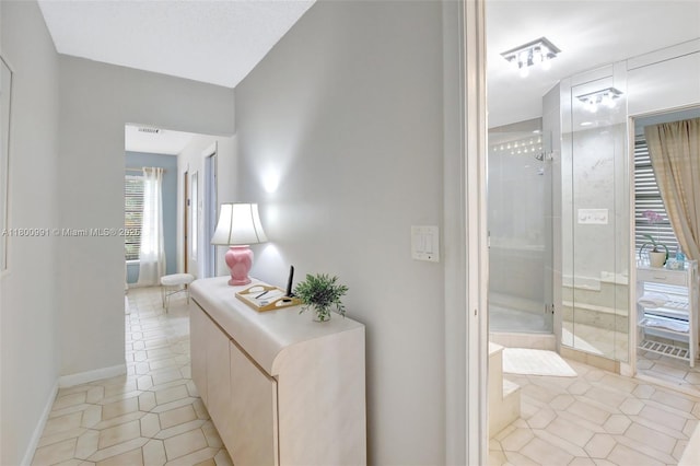 6001 SW 18th St, Plantation, FL 33317 - hallway featuring light tile patterned flooring and baseboards