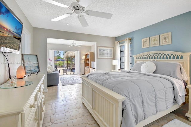 6001 SW 18th St, Plantation, FL 33317 - bedroom featuring access to outside, a textured ceiling, a ceiling fan, and light tile patterned floors