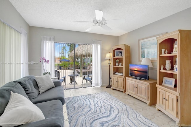 6001 SW 18th St, Plantation, FL 33317 - living area featuring a textured ceiling, ceiling fan, and light tile patterned floors