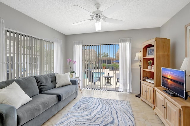 6001 SW 18th St, Plantation, FL 33317 - living area with ceiling fan, a textured ceiling, and light tile patterned floors