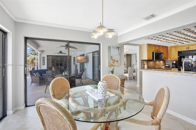 6001 SW 18th St, Plantation, FL 33317 - dining space with ceiling fan, baseboards, light tile patterned floors, and ornamental molding