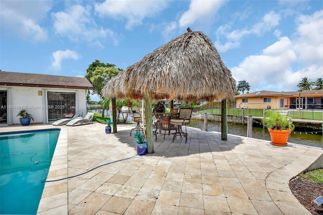 6001 SW 18th St, Plantation, FL 33317 - view of swimming pool with a patio, a water view, and fence