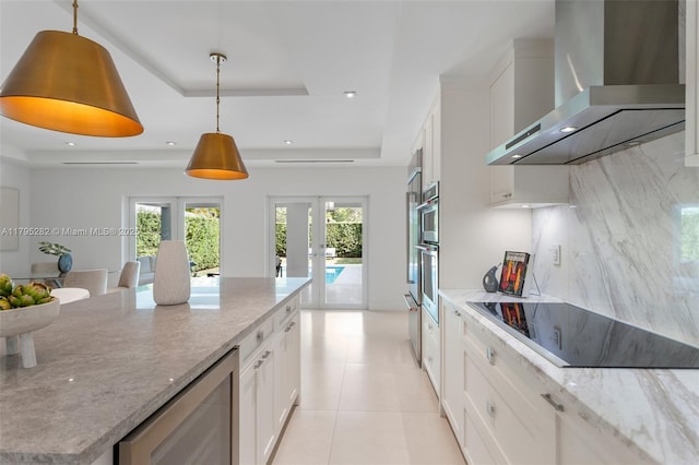 1415 Madrid St, Coral Gables, FL 33134 - kitchen with wall chimney range hood, black electric cooktop, wine cooler, a raised ceiling, and white cabinetry