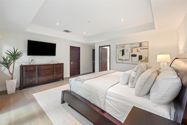 1415 Madrid St, Coral Gables, FL 33134 - bedroom with a raised ceiling, light wood-style flooring, and recessed lighting