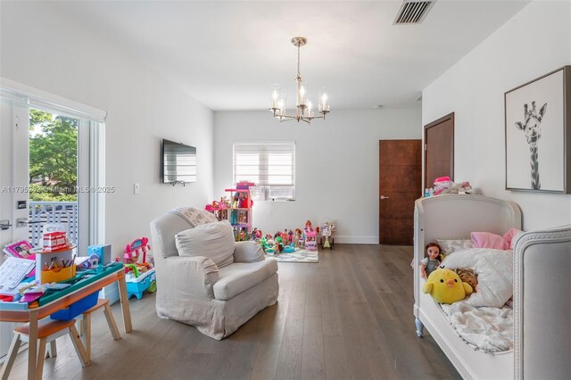 1415 Madrid St, Coral Gables, FL 33134 - recreation room featuring a chandelier, wood finished floors, and baseboards