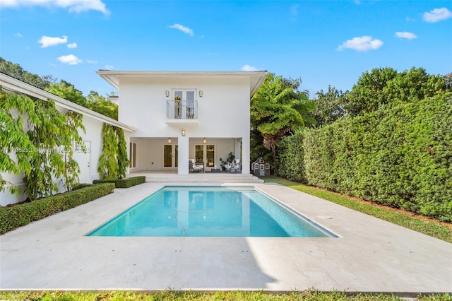 1415 Madrid St, Coral Gables, FL 33134 - back of house with a patio area, a balcony, stucco siding, and french doors