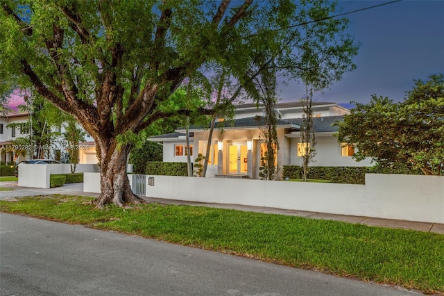 1415 Madrid St, Coral Gables, FL 33134 - view of front of home featuring a fenced front yard and stucco siding