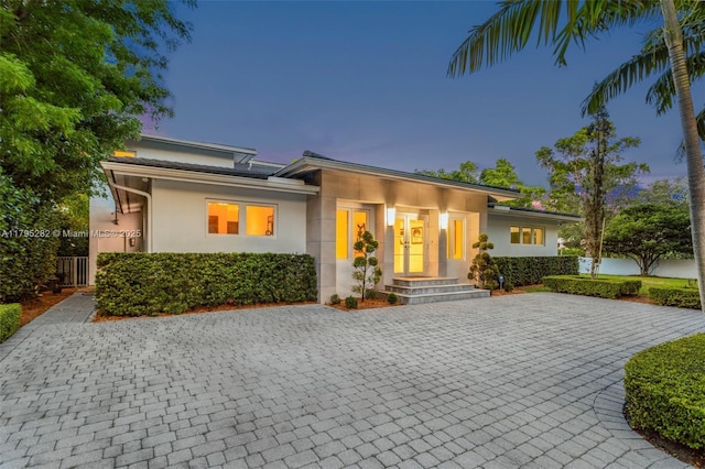 1415 Madrid St, Coral Gables, FL 33134 - view of front of property featuring stucco siding and decorative driveway