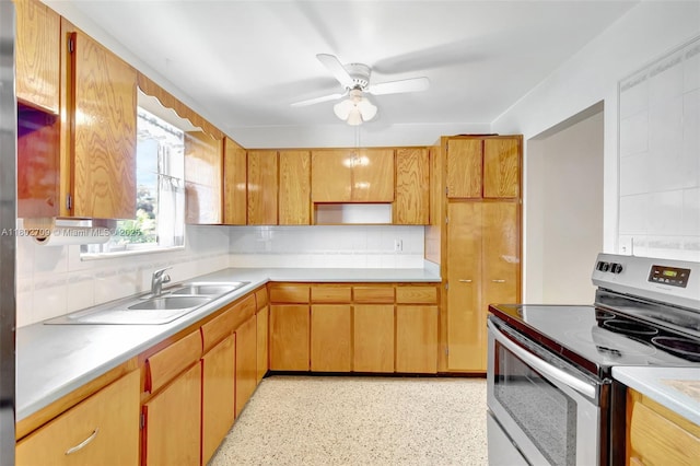 1920 SW 65th Ter, North Lauderdale, FL 33068 - kitchen featuring stainless steel range with electric stovetop, tasteful backsplash, ceiling fan, light countertops, and a sink