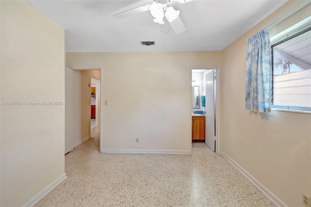 1920 SW 65th Ter, North Lauderdale, FL 33068 - spare room featuring dark speckled floor, a ceiling fan, and baseboards