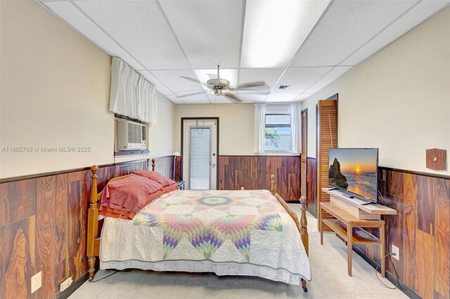 1920 SW 65th Ter, North Lauderdale, FL 33068 - bedroom featuring wooden walls, wainscoting, a paneled ceiling, cooling unit, and a ceiling fan