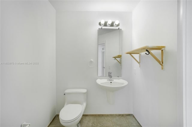 60 SW 13th St Unit 2100, Miami, FL 33130 - half bath with toilet, baseboards, and tile patterned flooring