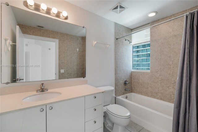 60 SW 13th St Unit 2100, Miami, FL 33130 - bathroom featuring shower / bathtub combination with curtain, toilet, vanity, and tile patterned flooring