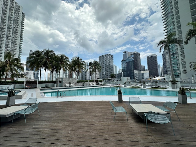 90 SW 3rd St Unit 1909, Miami, FL 33130 - community pool featuring a wooden deck and a view of skyline
