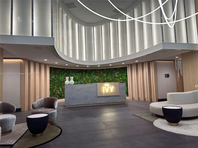 90 SW 3rd St Unit 1909, Miami, FL 33130 - community lobby with a towering ceiling, wallpapered walls, and recessed lighting