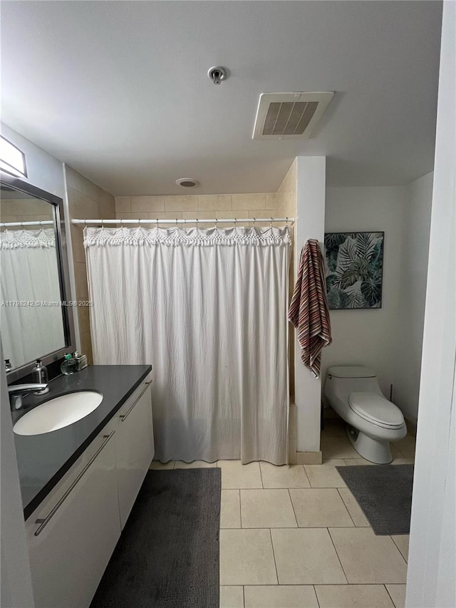 90 SW 3rd St Unit 1909, Miami, FL 33130 - bathroom featuring vanity, toilet, tile patterned flooring, and curtained shower