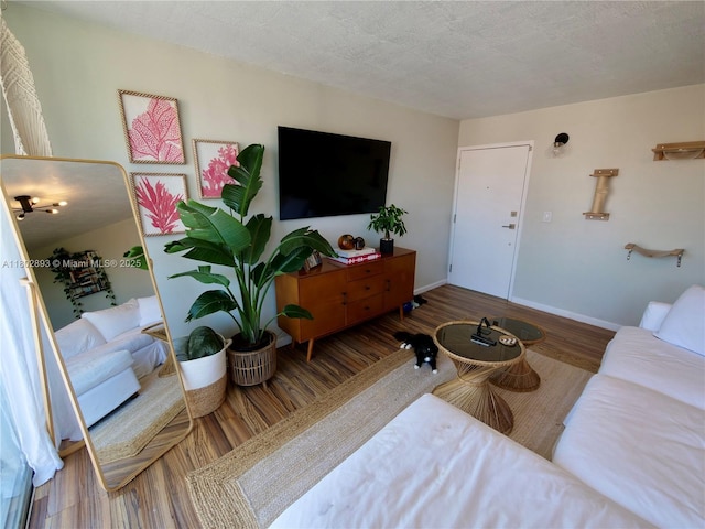 16518 NE 26th Ave Unit 305, North Miami Beach, FL 33160 - living room featuring wood finished floors and baseboards