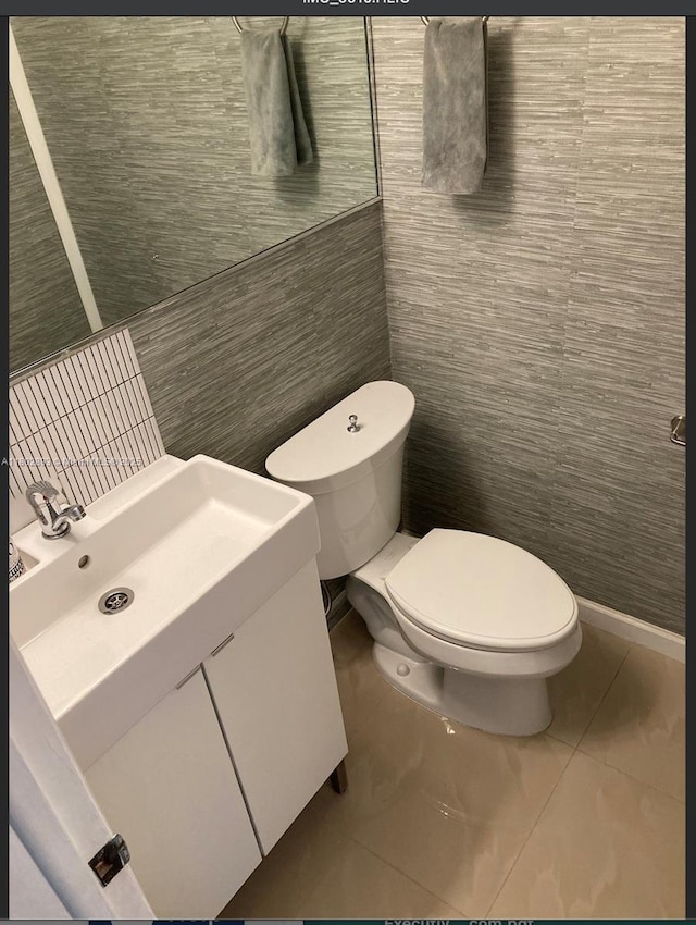 16518 NE 26th Ave Unit 305, North Miami Beach, FL 33160 - bathroom with toilet, vanity, and tile walls