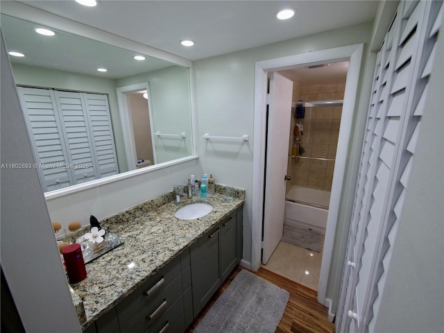 16518 NE 26th Ave Unit 305, North Miami Beach, FL 33160 - full bathroom with wood finished floors, vanity, recessed lighting, a closet, and shower / bathtub combination