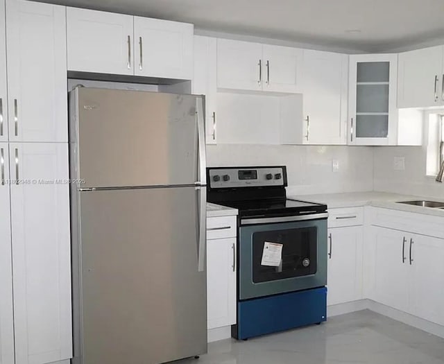 691 S Hollybrook Dr Unit 208, Pembroke Pines, FL 33025 - kitchen with stainless steel appliances, a sink, light countertops, and white cabinetry