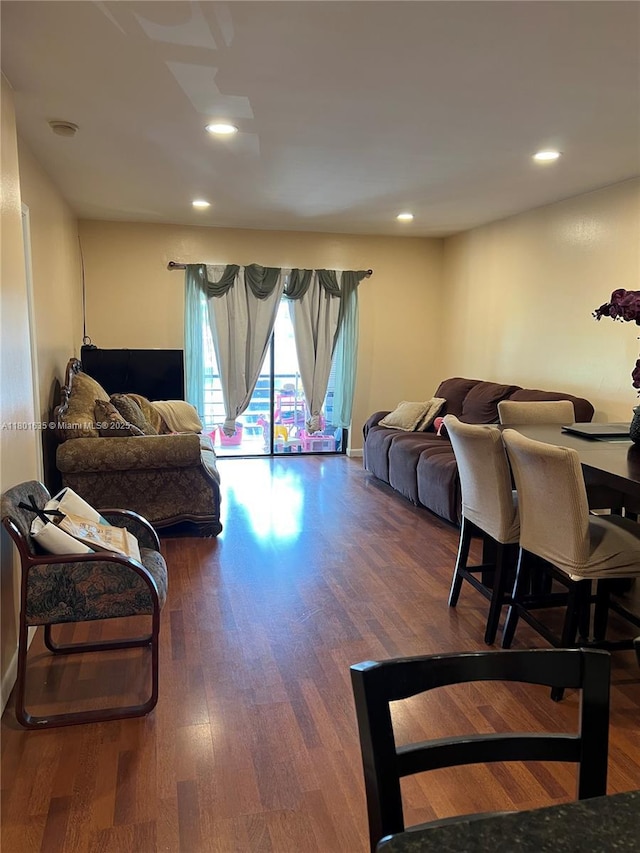 living area with wood finished floors and recessed lighting