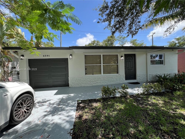 6391 SW 8th St, North Lauderdale, FL 33068 - view of front of home featuring stucco siding, an attached garage, and concrete driveway