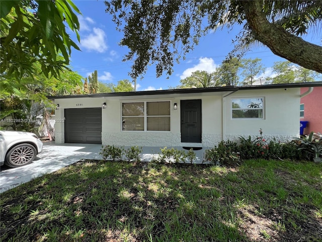 6391 SW 8th St, North Lauderdale, FL 33068 - ranch-style house featuring an attached garage, stucco siding, and concrete driveway