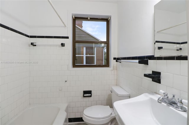 2196 Traymore Rd, Jacksonville, FL 32207 - full bath featuring a sink, tile walls, and toilet