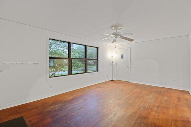2196 Traymore Rd, Jacksonville, FL 32207 - empty room featuring wood finished floors, baseboards, and a ceiling fan