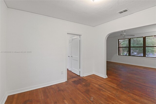 2196 Traymore Rd, Jacksonville, FL 32207 - spare room with arched walkways, hardwood / wood-style floors, baseboards, and a ceiling fan