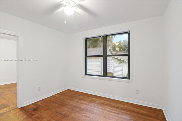 2196 Traymore Rd, Jacksonville, FL 32207 - unfurnished room with wood finished floors, baseboards, and ceiling fan