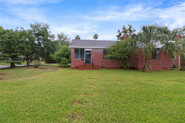 2196 Traymore Rd, Jacksonville, FL 32207 - single story home featuring entry steps, brick siding, and a front lawn