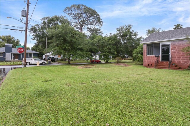 2196 Traymore Rd, Jacksonville, FL 32207 - view of green lawn featuring entry steps