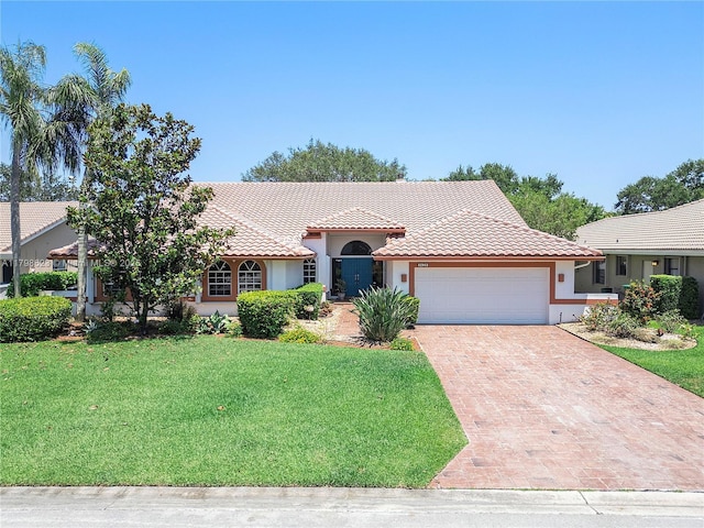 5425 NW 86th Ter, Coral Springs, FL 33067 - view of front of property with a garage, stucco siding, a front lawn, decorative driveway, and a tile roof
