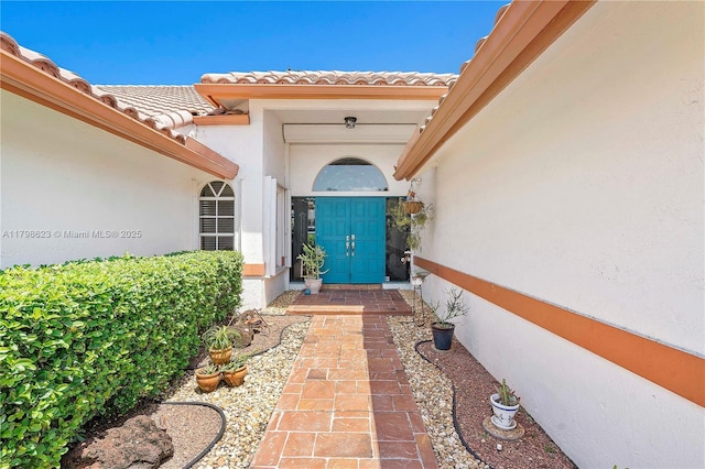 5425 NW 86th Ter, Coral Springs, FL 33067 - doorway to property with stucco siding and a tiled roof