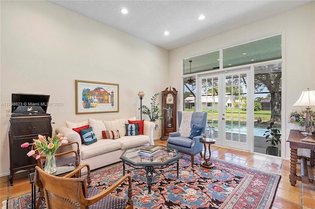 5425 NW 86th Ter, Coral Springs, FL 33067 - living area featuring french doors, recessed lighting, and a textured ceiling