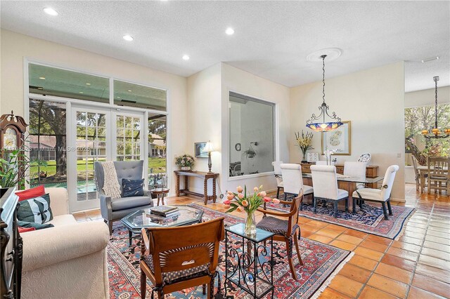 5425 NW 86th Ter, Coral Springs, FL 33067 - living area with a textured ceiling, recessed lighting, tile patterned floors, and a chandelier