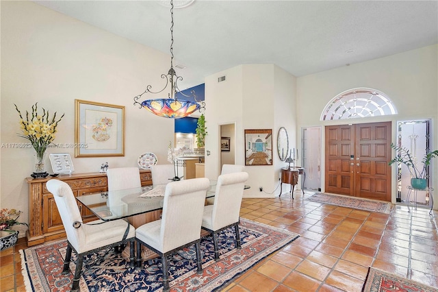 5425 NW 86th Ter, Coral Springs, FL 33067 - dining room featuring a high ceiling, a chandelier, and tile patterned floors