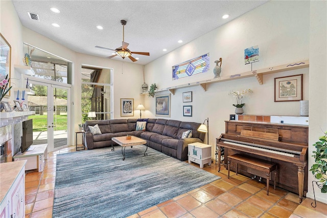 5425 NW 86th Ter, Coral Springs, FL 33067 - living room featuring a ceiling fan, recessed lighting, a textured ceiling, french doors, and a high ceiling