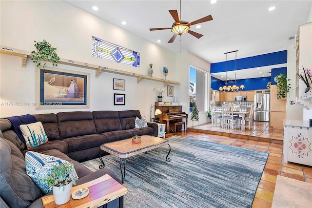 5425 NW 86th Ter, Coral Springs, FL 33067 - living room featuring a ceiling fan, recessed lighting, a chandelier, and light tile patterned flooring