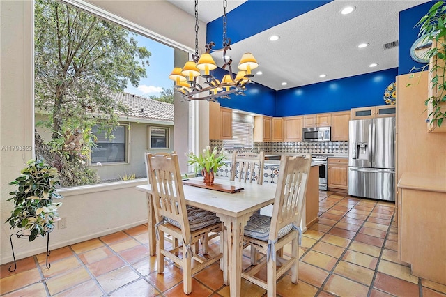 5425 NW 86th Ter, Coral Springs, FL 33067 - dining room with a chandelier, a textured ceiling, light tile patterned flooring, recessed lighting, and a high ceiling