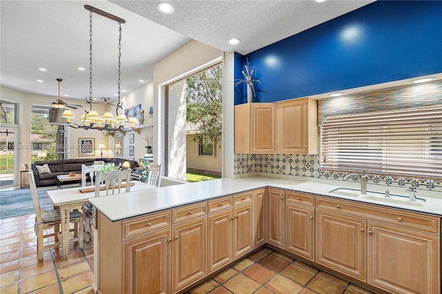 5425 NW 86th Ter, Coral Springs, FL 33067 - kitchen featuring a sink, light countertops, healthy amount of natural light, recessed lighting, and a textured ceiling
