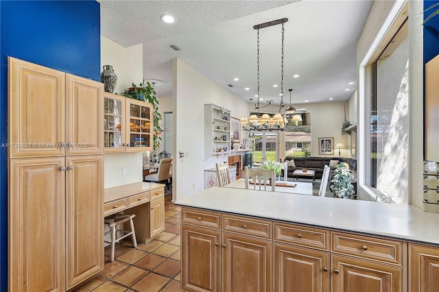 5425 NW 86th Ter, Coral Springs, FL 33067 - kitchen with light countertops, open floor plan, light tile patterned floors, glass insert cabinets, and a textured ceiling