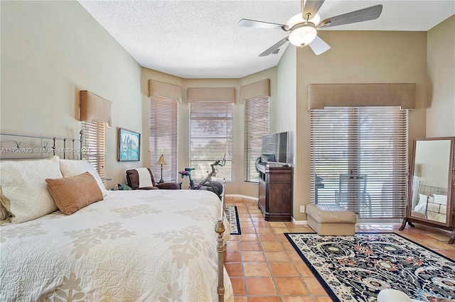 5425 NW 86th Ter, Coral Springs, FL 33067 - bedroom with multiple windows, light tile patterned floors, a textured ceiling, and a ceiling fan