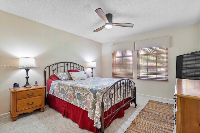 5425 NW 86th Ter, Coral Springs, FL 33067 - bedroom with carpet, baseboards, a textured ceiling, and ceiling fan