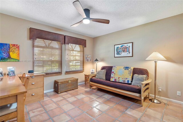 5425 NW 86th Ter, Coral Springs, FL 33067 - sitting room featuring ceiling fan, baseboards, a textured ceiling, and light tile patterned floors