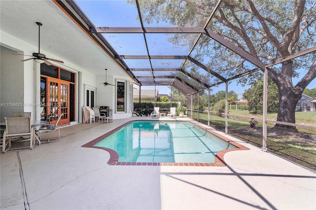 5425 NW 86th Ter, Coral Springs, FL 33067 - swimming pool with french doors, ceiling fan, a patio, and glass enclosure
