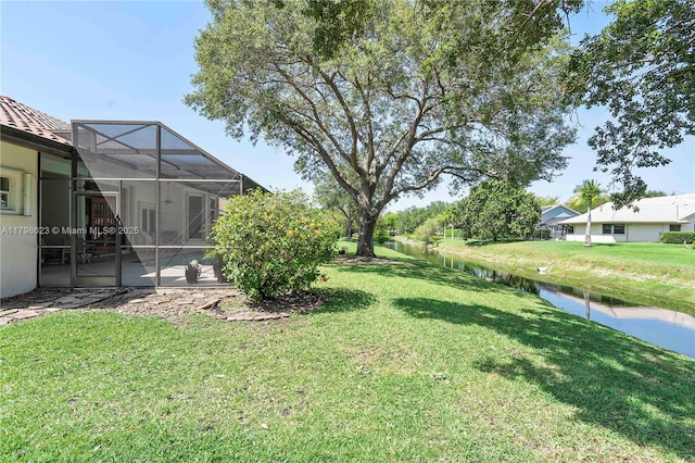 5425 NW 86th Ter, Coral Springs, FL 33067 - view of green lawn with a lanai, a water view, and a patio area