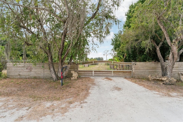 260 Taft Blvd, Clewiston, FL 33440 - view of dirt / gravel road with a gate