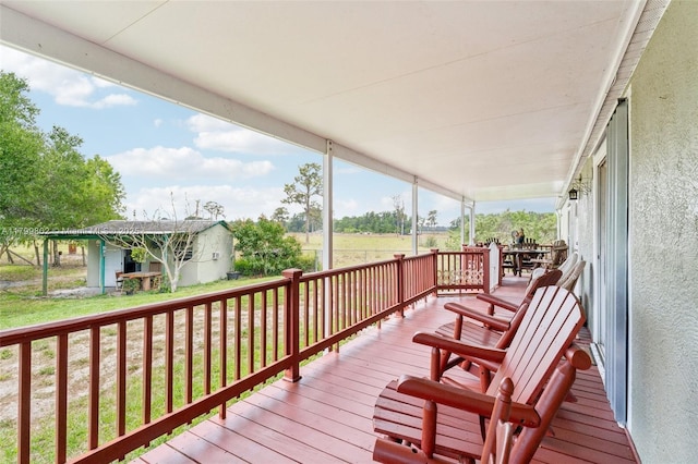 260 Taft Blvd, Clewiston, FL 33440 - wooden deck featuring a porch and a yard